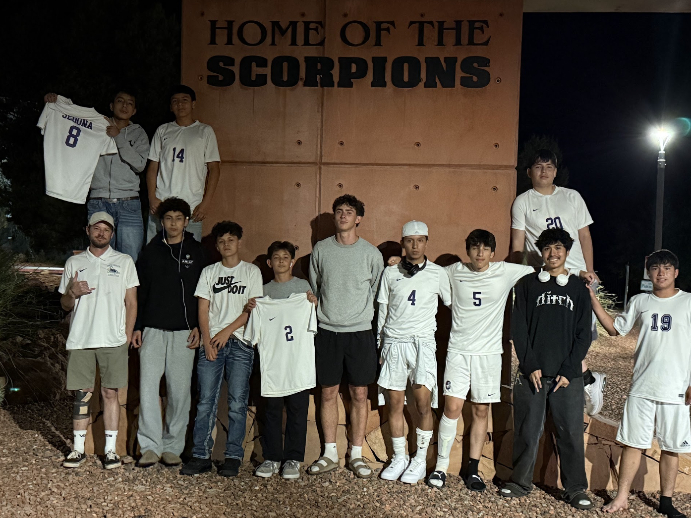 Players at the Home of the Scorpions sign